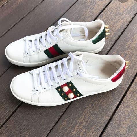 gucci ace sneakers that say sport in on the back